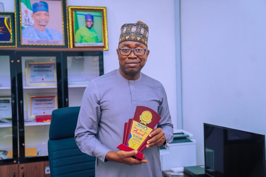 Rotary Club Honours Dr. Napoleon Gyobe Elia with Above Self Merit Award for Environmental Impact